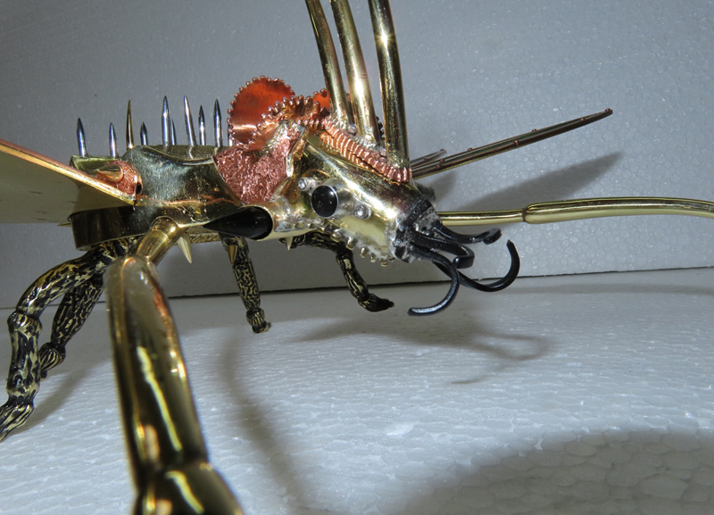 Buzz Beetle Fighter adding  spikes and fangs to the head